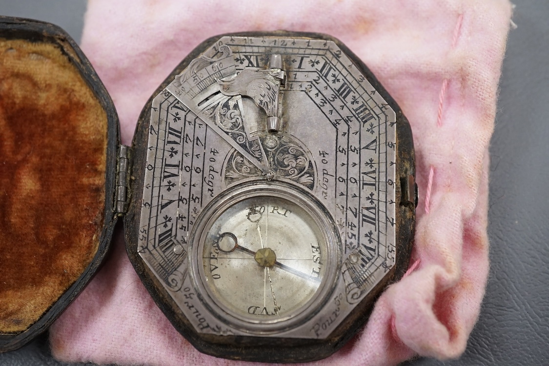 An early 18th century French silvered Butterfield pattern pocket sundial by Bion, Paris, with engraved octagonal plate and the gnomen supported by birds, the reverse engraved with the latitudes of various European cities